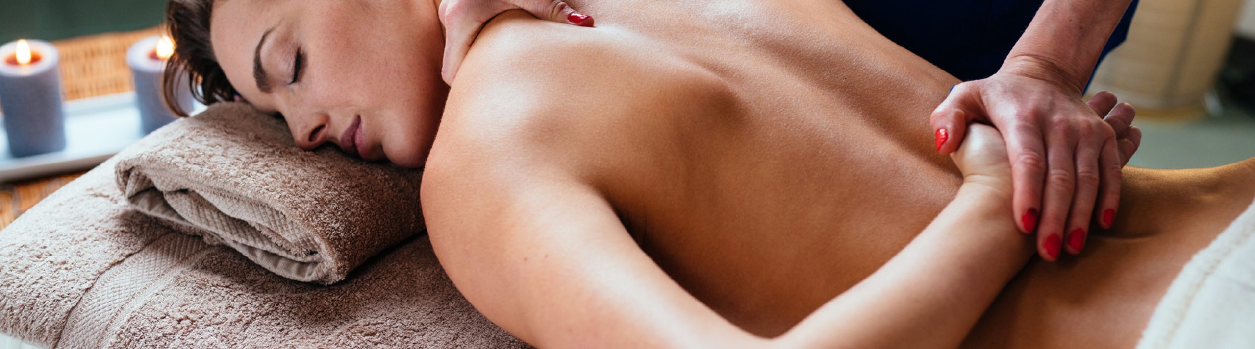 Beautiful woman getting thai massage in spa